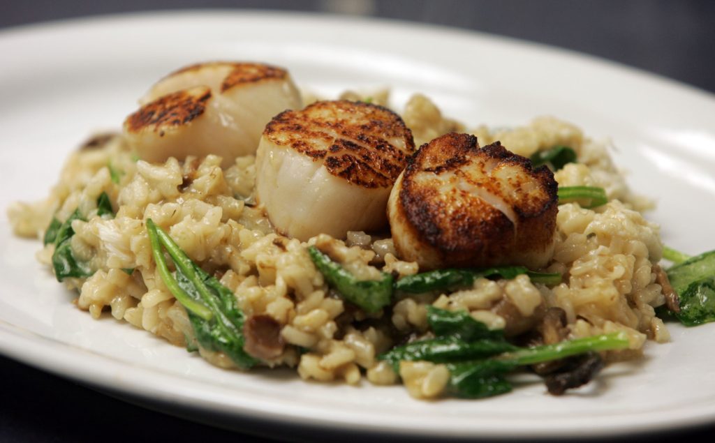 LAVALLETTE - 4/1/11 - Day Boat Scallops Risotto Ð with mushroom, spinach and crab is one of the featured dishes at the Ohana Grill at 65 Grand Central Avenue in Lavallette.    OHANAGRILL0401D - ASBURY PARK PRESS PHOTO BY THOMAS P. COSTELLO